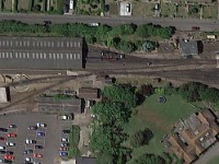 00 Romney Station  A Google Maps view of Romney station. Big centre is the station's hall. Below it is the turntable. The white building to the left of the turn tbale is the reseption and restaurant area. The building at the right is the depot and maintenance facility.